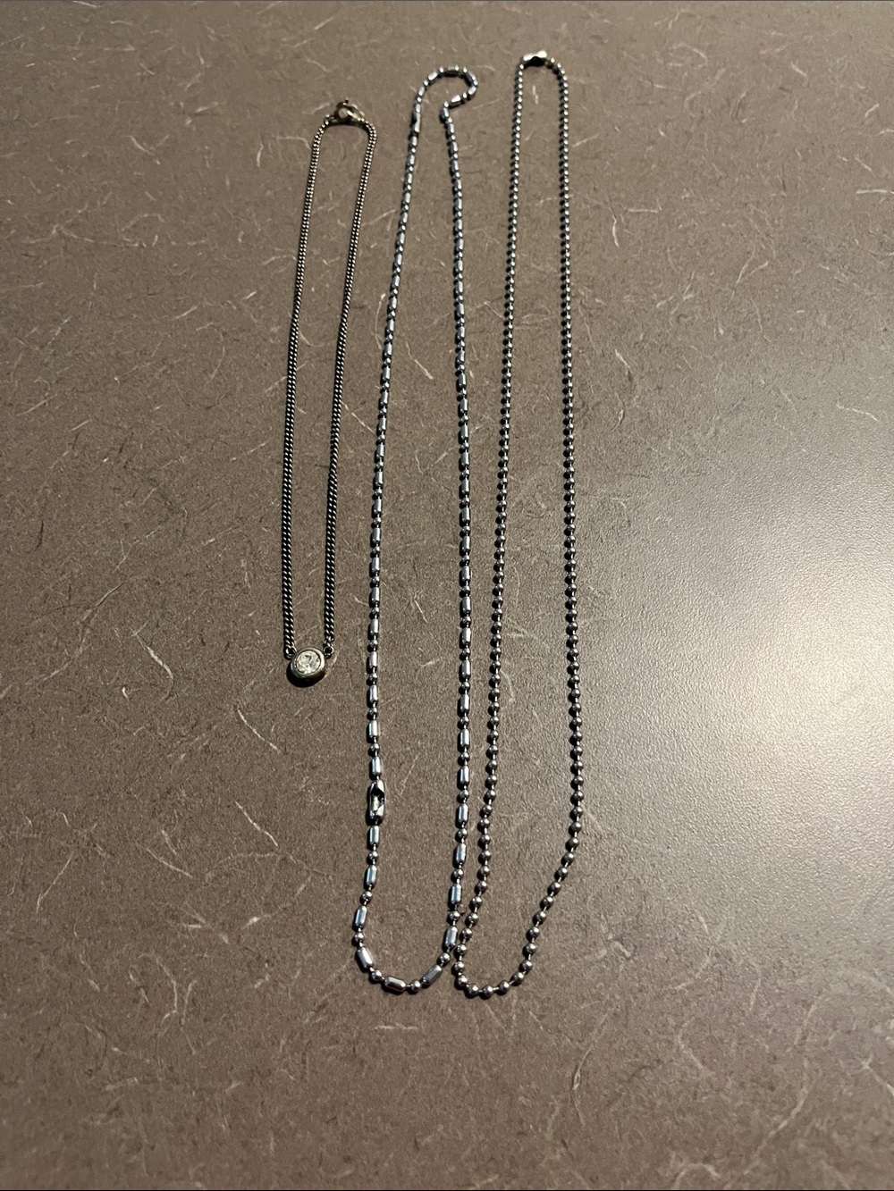 Necklace with clear stone 8” clasped and 2 silvertone chains. 12-14”